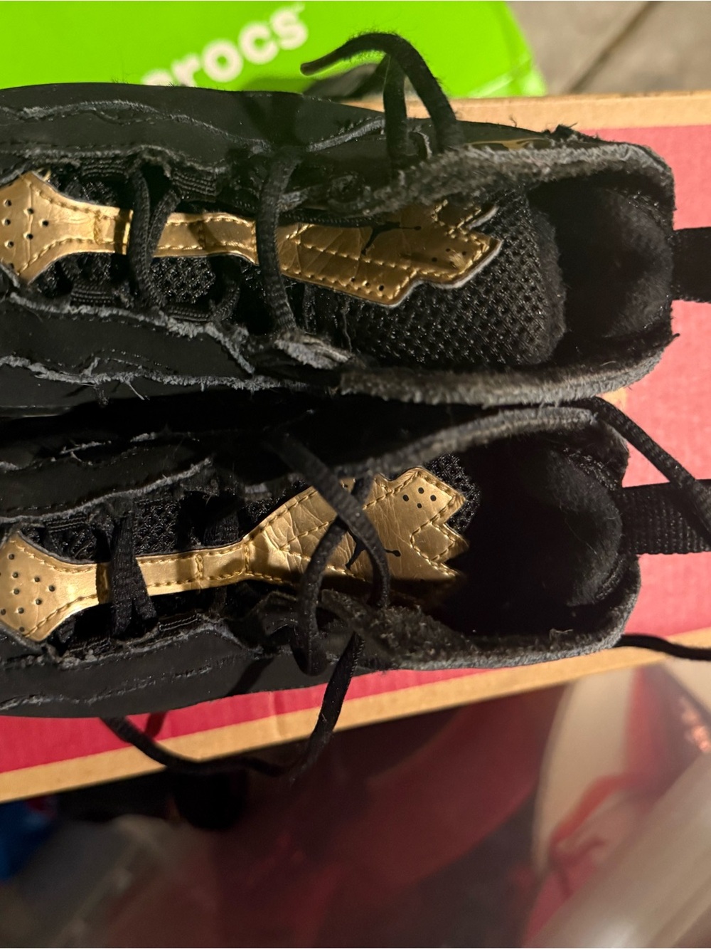 Nike Kids Black Sneakers with Gold Accent Detailing